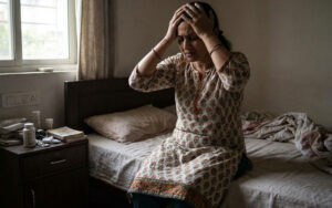 Woman experiencing emotional distress from adenomyosis and fertility challenges, representing the mental health impact of chronic pelvic pain