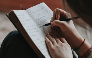 A woman writing in a journal